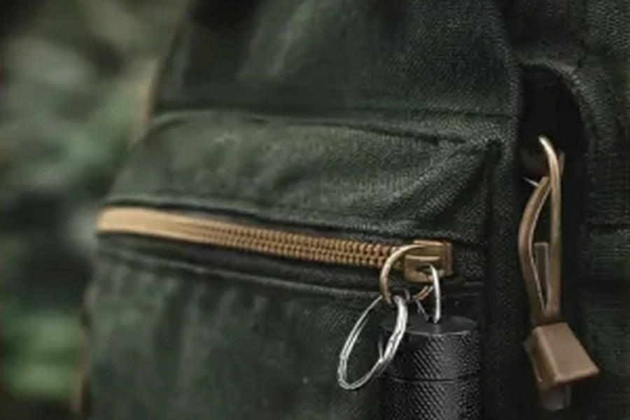 NOPKEY case clipped to a backpack zipper for bag and work carry